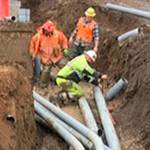 Because of recent rains, crews encounter muddy conditions in the joint utility trench that is being installed as part of the Silverdale Way Road Improvement Project. (Kitsap County Public Works)