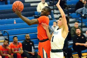 <em>Zion Archer drives the lane against Gig Harbor. The Cougars took home an important league victory, 67-50, on Jan. 17.</em>Mark Krulish/Kitsap News Group