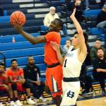 <em>Zion Archer drives the lane against Gig Harbor. The Cougars took home an important league victory, 67-50, on Jan. 17.</em>Mark Krulish/Kitsap News Group