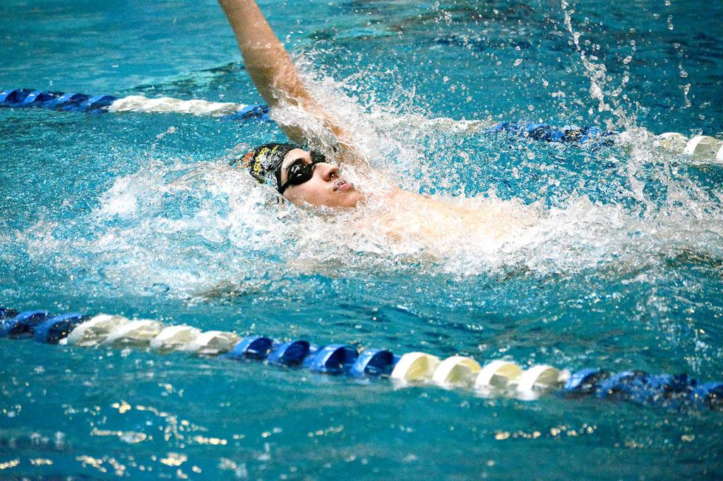 Aron Markow of Kingston swam a state-qualifying time of 57.10 in the 100-yard backstroke. (Mark Krulish/Kitsap News Group)