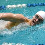 <em>Olympics Haakon Meyer swims a state-qualifying time during the 500-yard freestyle, giving him Ironman status. </em>Mark Krulish/Kitsap News Group