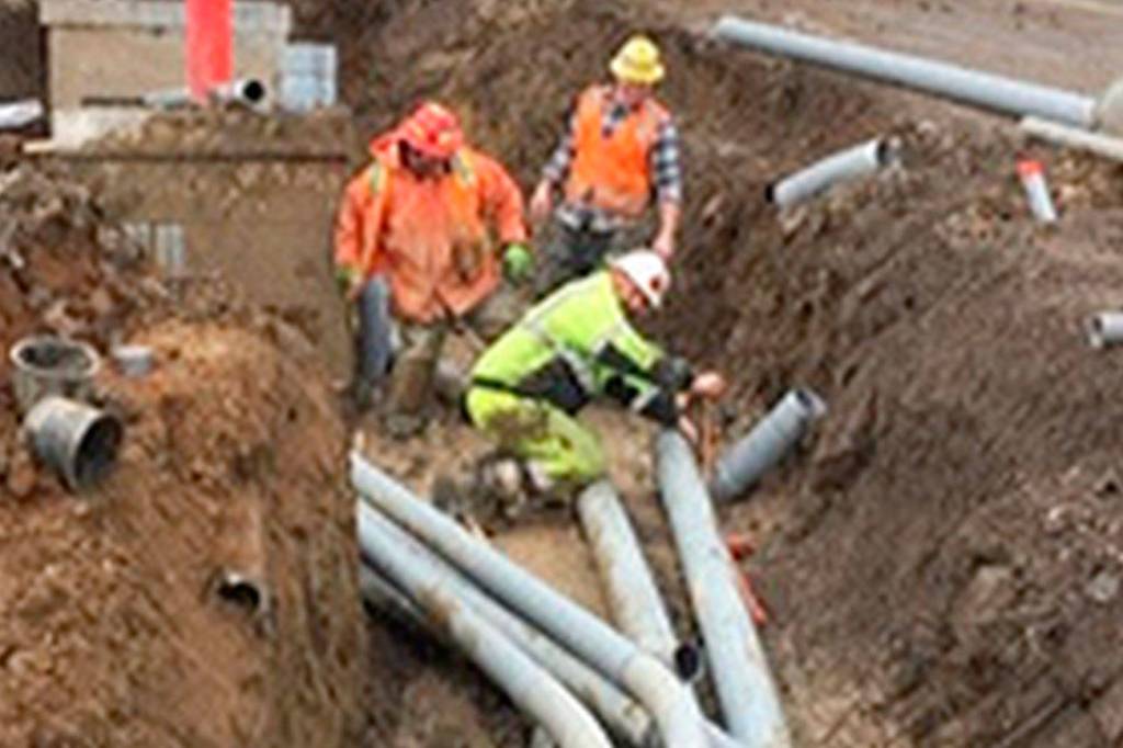 Because of recent rains, crews encounter muddy conditions in the joint utility trench that is being installed as part of the Silverdale Way Road Improvement Project. (Kitsap County Public Works)