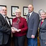 State Sen. Jan Angel receives the 2017 Outstanding Services to Veterans  Legislator of the Year Award in her Senate office Monday. From left to right: Larry Alcantara, vice chair of the Governors Veterans Affairs Advisory Committee; Angel; Charles Wharton, chair of the Governors Veterans Affairs Advisory Committee; and Alfie Alvarado-Ramos, director of the Washington State Department of Veterans Affairs. (Office of Sen. Jan Angel photo)