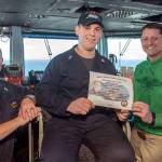 Machinists Mate 2nd Class Samuel J. Willhoite of Poulsbo receives the Sailor of the Day award from Capt. Greg Huffman, USS John C. Stennis (CVN 74) commanding officer, and Command Master Chief Benjamin Rushing. (Mass Communication Specialist Seaman Erika Kugler/U.S. Navy)