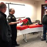 <em>At a well-attended reception in early January, retiring NKF&R Fire Commissioner Fernando Espy Espinosa, second from right, was honored with gifts presented by, from left, NKF&R Fire Chief Dan Smith, NKF&R Assistant Chief Rick LaGrandeur, and fellow commissioner Stephen Neupert.  </em>NKF&R photo
