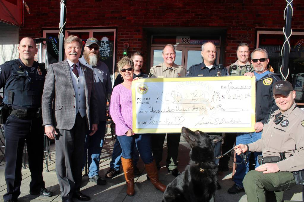 <em>The Gavin Buchanan Memorial Foundation raised $6,240 for the KCSO and BPD K-9 units.</em> (Michelle Beahm | Kitsap Daily News)