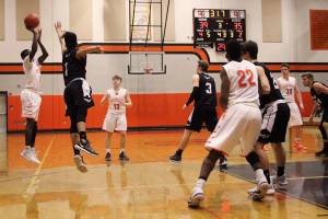 Central Kitsap senior guard Zion Archer attempts a 3-pointer in the third quarter of the contest against Peninsula on Jan. 30. The Cougars lost 63-60 in overtime. (Jacob Moore/Kitsap News Group)