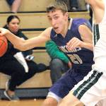 North Kitsaps Logan Chmielewski evades the defense of Port Angeles Colton McGuffey during the third quarter on Tuesday night at Port Angeles High School. (Keith Thorpe/Peninsula Daily News)