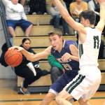 North Kitsaps Logan Chmielewski evades the defense of Port Angeles Colton McGuffey during the third quarter on Tuesday night at Port Angeles High School. (Keith Thorpe/Peninsula Daily News)