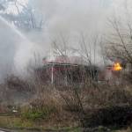 Bremerton city firefighters were working at 5 p.m. Feb. 3 to contain a house fire on Tracyton Beach Road. (Jacob Moore/Kitsap News Group)
