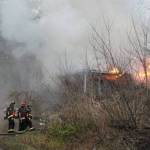 Bremerton city firefighters were working at 5 p.m. Feb. 3 to contain a house fire on Tracyton Beach Road. (Jacob Moore/Kitsap News Group)