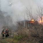 Bremerton city firefighters were working at 5 p.m. Feb. 3 to contain a house fire on Tracyton Beach Road. (Jacob Moore/Kitsap News Group)