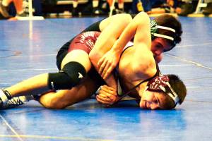 <em>Phil Stafford, shown here wrestling Clayton Brooks of South Kitsap at the HammerHead Tournament in December, was one of six Klahowya wrestlers to capture the top spot at the Sub-Regional Tournament.</em> Mark Krulish/Kitsap News Group