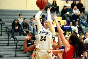 <em>Katie Hughes (24) goes up for a layup against the Franklin Pierce defense in her teams district playoff opener. North Kitsap won 67-31.</em>Mark Krulish/Kitsap News Group