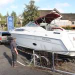 Aaron Wenholz observes as Gary Sanders pulls the previously sunk Wavelength out of Liberty Bay. Nick Twietmeyer | Kitsap News Group