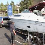 Volunteers hoist sunken boat out of Liberty Bay