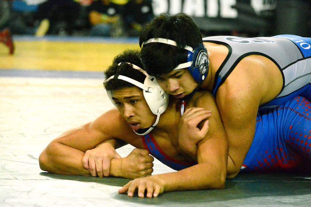 Olympics Kyle Ignacio took third at the 2A state wrestling tournament at 160 pounds. Here, Ignacio defeats Braxton Seich of Washington, 12-3, in the second round of the tournament. (Mark Krulish/Kitsap News Group)