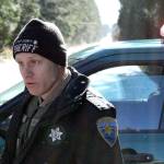 Kitsap County Sheriffs Deputy Schon Montague estimates there are about 150 homes in the secured area. He was controlling traffic at Clear Creek Road and Closser Drive. (Nick Twietmeyer/Kitsap News Group)