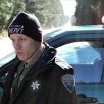 Kitsap County Sheriffs Deputy Schon Montague estimates there are about 150 homes in the secured area. He was controlling traffic at Clear Creek Road and Closser Drive. (Nick Twietmeyer/Kitsap News Group)