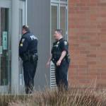 Bainbridge police stand outside the main building at Bainbridge High during Wednesdays lockdown. (Luciano Marano | Bainbridge Review)