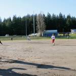 Sophomore Morgan Kroeber in the batters box to face senior Dani Snyder, who tosses a pitch during a March 6 practice at Olympic High School. Jacob Moore | Kitsap News Group