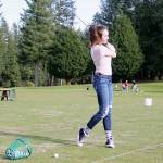 Junior golfer Lucy Holloway practices her swing at Gold Mountain Golf Course during a March 12 practice. (Jacob Moore/Kitsap News Group)
