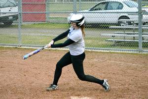 <em>Kingston catcher Meghan Fenwick takes a few swings at a practice before her teams first game of the season.</em>                                Mark Krulish / Kitsap News Group