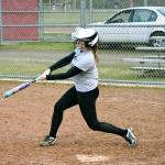 <em>Kingston catcher Meghan Fenwick takes a few swings at a practice before her teams first game of the season.</em>                                Mark Krulish / Kitsap News Group