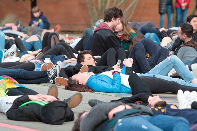 Students at Bainbridge High School stage a die-in protesting for improved school security. Photo by Brian Kelly