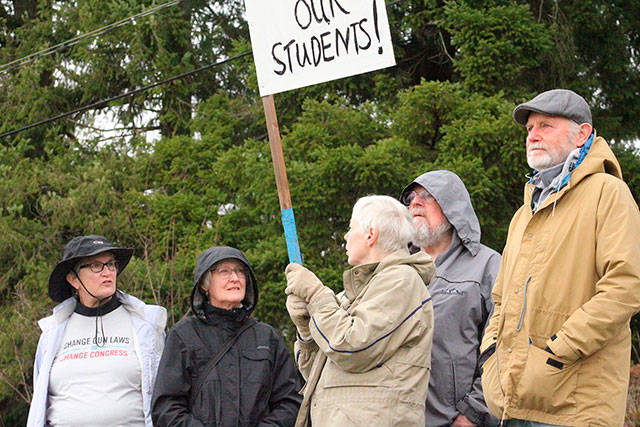 Supporters of North Kitsap Students during a walkout discuss the rising trend of mass shootings. Photo by Nick Twietmeyer