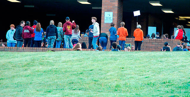 Students at South Kitsap High School hold a walkout in protest of gun violence. Photo by Bob Smith