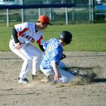 Central Kitsap shortstop Fred Buckson tags out Bainbridge baserunner Theo Colgan. (Mark Krulish/Kitsap News Group)