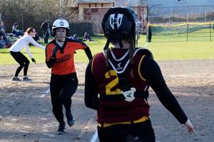 Senior Zee Young comes home on a single by freshman Brooke Mimaki in the first inning of Central Kitsaps game against Kingston on March 15. (Jacob Moore/Kitsap Daily News)