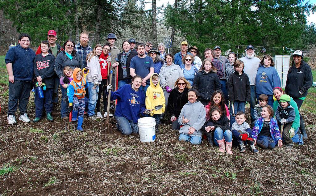Gleaning volunteers gather for a group photo at the end of their harvesting work at Rokalu Farm in South Kitsap on March 18. (Bob Smith | Kitsap Daily News)