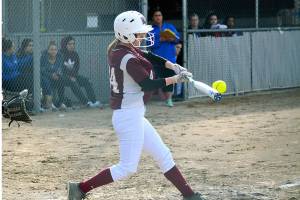 South Kitsap second baseman Teanna Lathum strikes one of her two singles in her teams 5-3 win over Olympic. (Mark Krulish/Kitsap News Group)