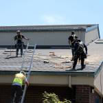 Roofers replace a tile roof at Hidden Creek Elementary in July 2015. (Chris Chancellor | Independent file photo 2015)