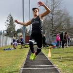 North Kitsaps Blake Wetzsteon leaps into the air during his triple jump. He wound up taking second place in the event. Jacob Moore | Kitsap News Group
