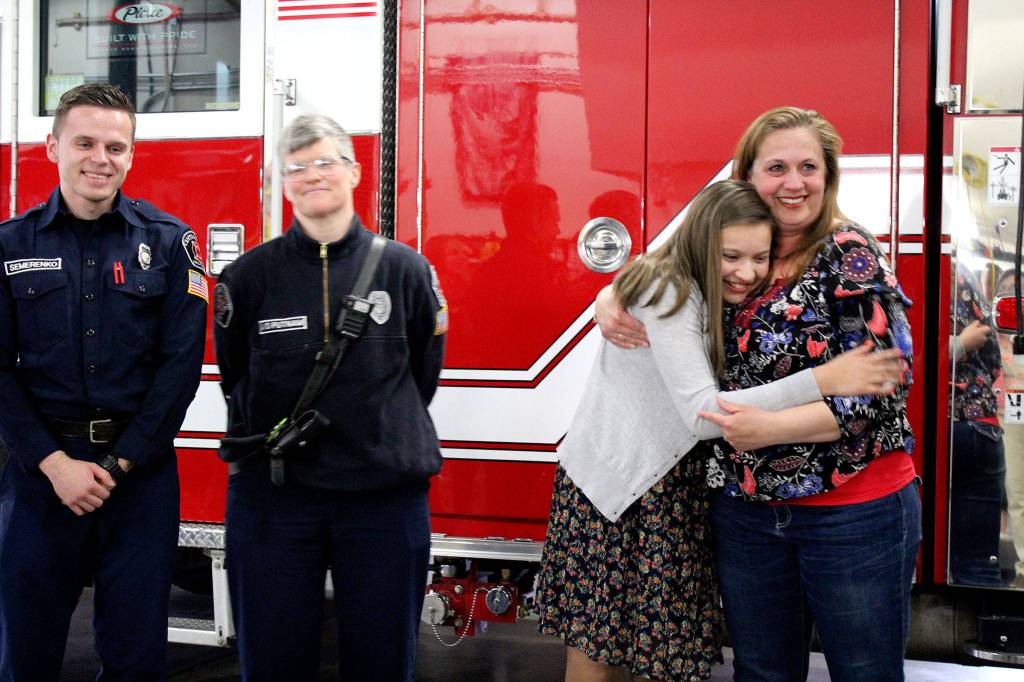 <em>Left to right: Ivan Semerenko, Kara Putnam, Elyza Gutierrez and Jennifer Gutierrez at the recognition for Elyzas early CPR on her mom during an emergency Nov. 10.</em>                                Michelle Beahm / Kitsap News Group
