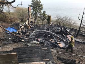 Lack of accessibility, nearby fire hydrant and late detection all contributed to a fire which completely engulfed a waterfront cabin in Kingston on March 30. Courtesy Michele Laboda, North Kitsap Fire & Rescue.