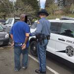 A Kent man, 33-year-old Dominic L. Dixon, was arrested in the March 22 hit-and-run accident on Peppermill Place Southeast and Sedgwick Road that killed Belfair resident Katie Phillips. She died while assisting a stranded motorist whose vehicle had run out of gas near the Southworth ferry dock. Dixon was identified and arrested on April 2 by Washington State Patrol detectives. His face was obscured in this WSP photo. (Washington State Patrol photo)