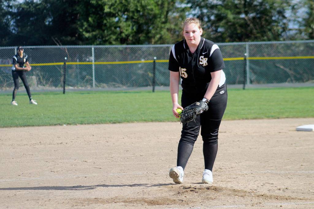 Wolves senior pitcher Kindra Hawkinson winds up before releasing a changeup in the second inning against the Lions. She hurled a six-inning complete game. Jacob Moore | Kitsap Daily News