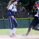 Wolves sophomore Lynden Wolf rolls into second base after a wild pitch during the first inning. She came around to score the second run of the game. Jacob Moore | Kitsap Daily News