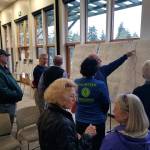 Audience members review maps depicting the preferred alignment of trail between Port Gamble and Stottlemeyer Road NE. Nick Twietmeyer | Kitsap News Group