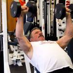 <em>Bob Covello using 40-pound weights to work out at Poulsbo Athletic Club on April 9. </em>Jacob Moore / Kitsap Daily News