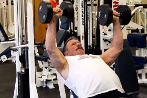 <em>Bob Covello using 40-pound weights to work out at Poulsbo Athletic Club on April 9. </em>Jacob Moore / Kitsap Daily News