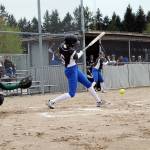 Olympic senior Ashlyn Morris grounds the ball toward third base in the first inning of the April 20 game against Port Angeles. Jacob Moore | Kitsap Daily News