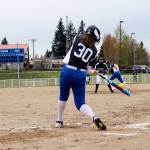 Trojans pitcher Dani Snyder laces a two-run single to right field in the first inning. She finished with two hits in the game. Jacob Moore | Kitsap Daily News