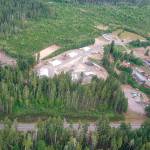 An aerial photo shows the landfill site at left and stockpile area in the center. Office trailers onsite during the cleanup are in the upper right of the photo. (Environmental Protection Agency photo 2017)