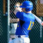 Andy McMartin drives a single into the outfield against Klahowya. (Mark Krulish/Kitsap News Group)