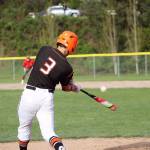 Cougars senior Rylee Orteza goes the other way on an outside pitch. Jacob Moore | Kitsap Daily News